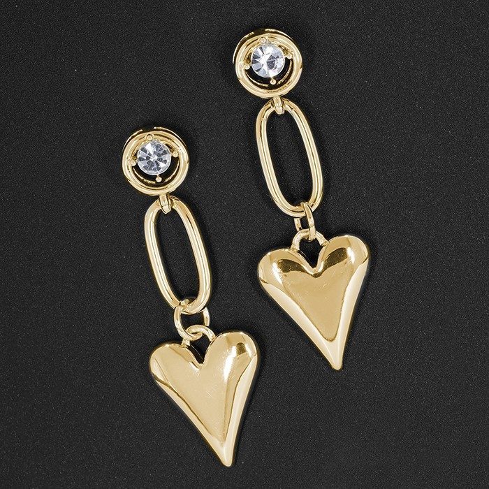 Gold plated heart earrings with a modern design, set in a simple setting