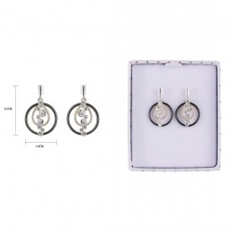 White earrings with silver sparkle accents and a clear setting, displayed on a white presentation box