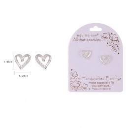 Close-up of silver stud earrings with a contemporary heart design, set in a simple setting